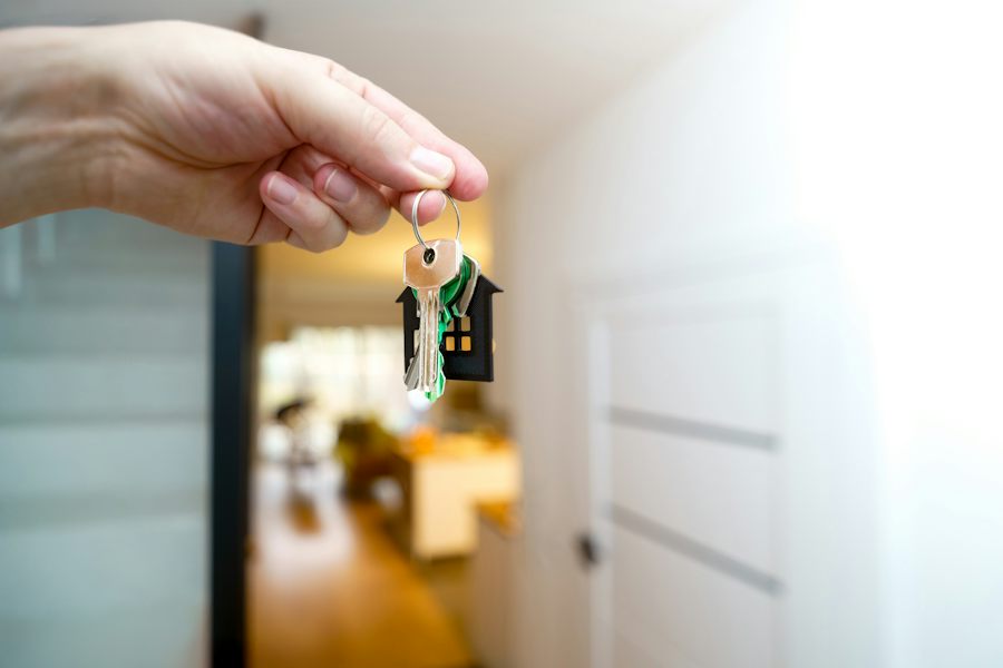 Hand holding a set of house keys